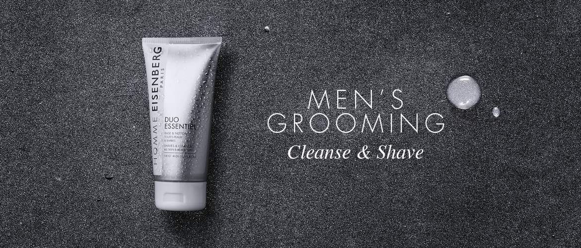 facial cleanser for men on a mirror and a grey chalk background